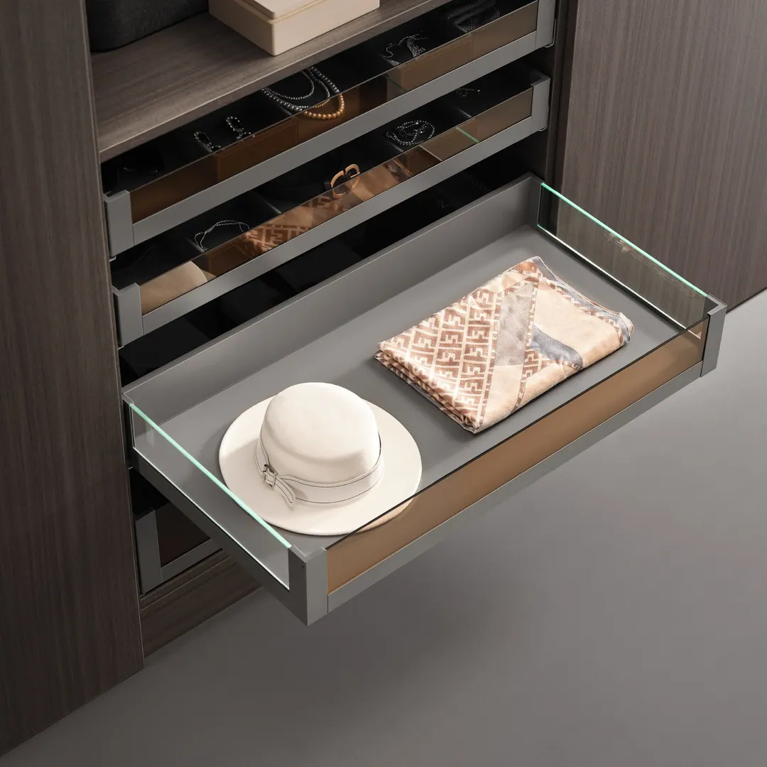 Closet drawers: a glass-fronted accessory drawer pulled open